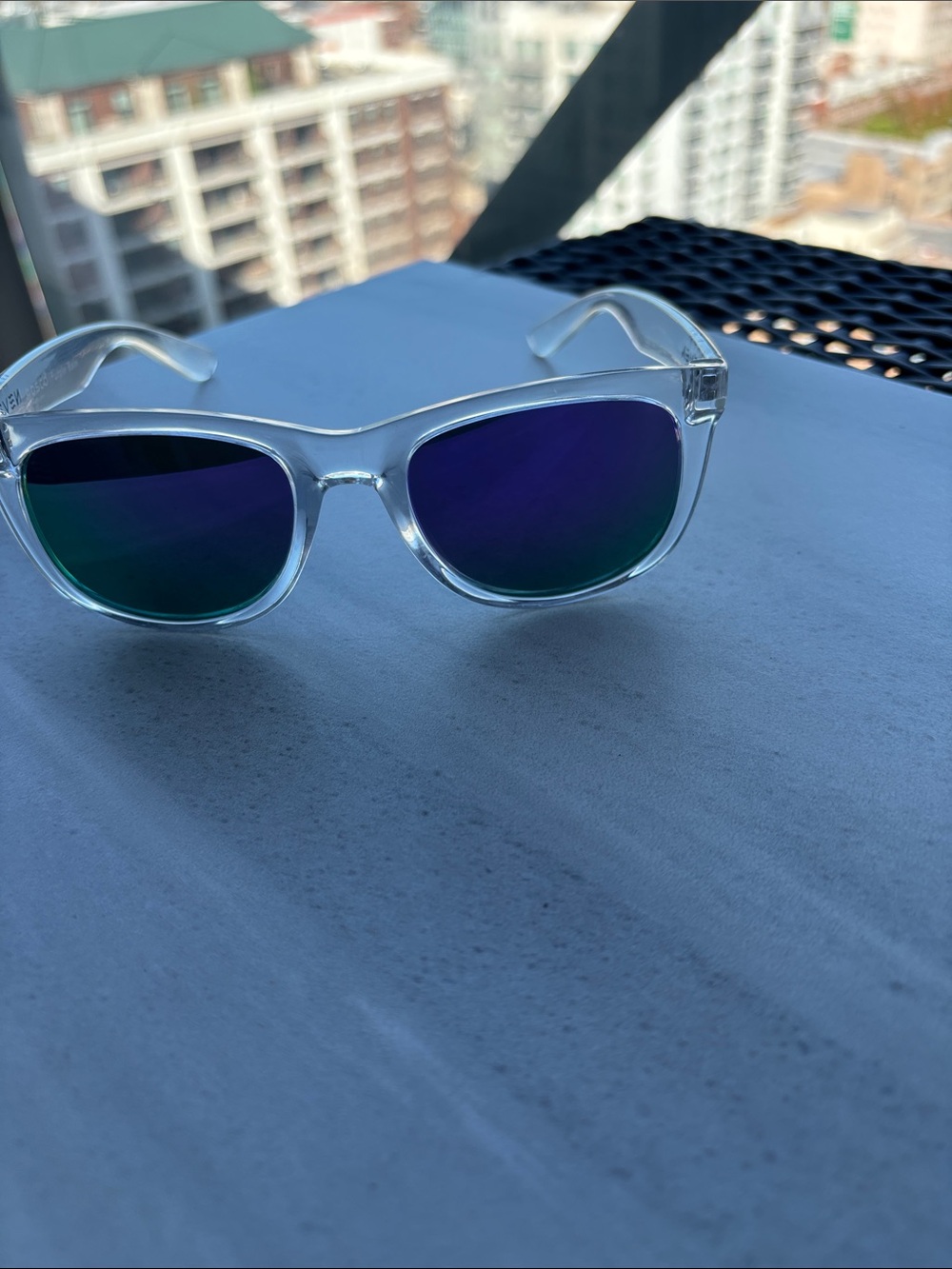 Clear Frame Sunglasses with Blue-Green Mirrored Lenses